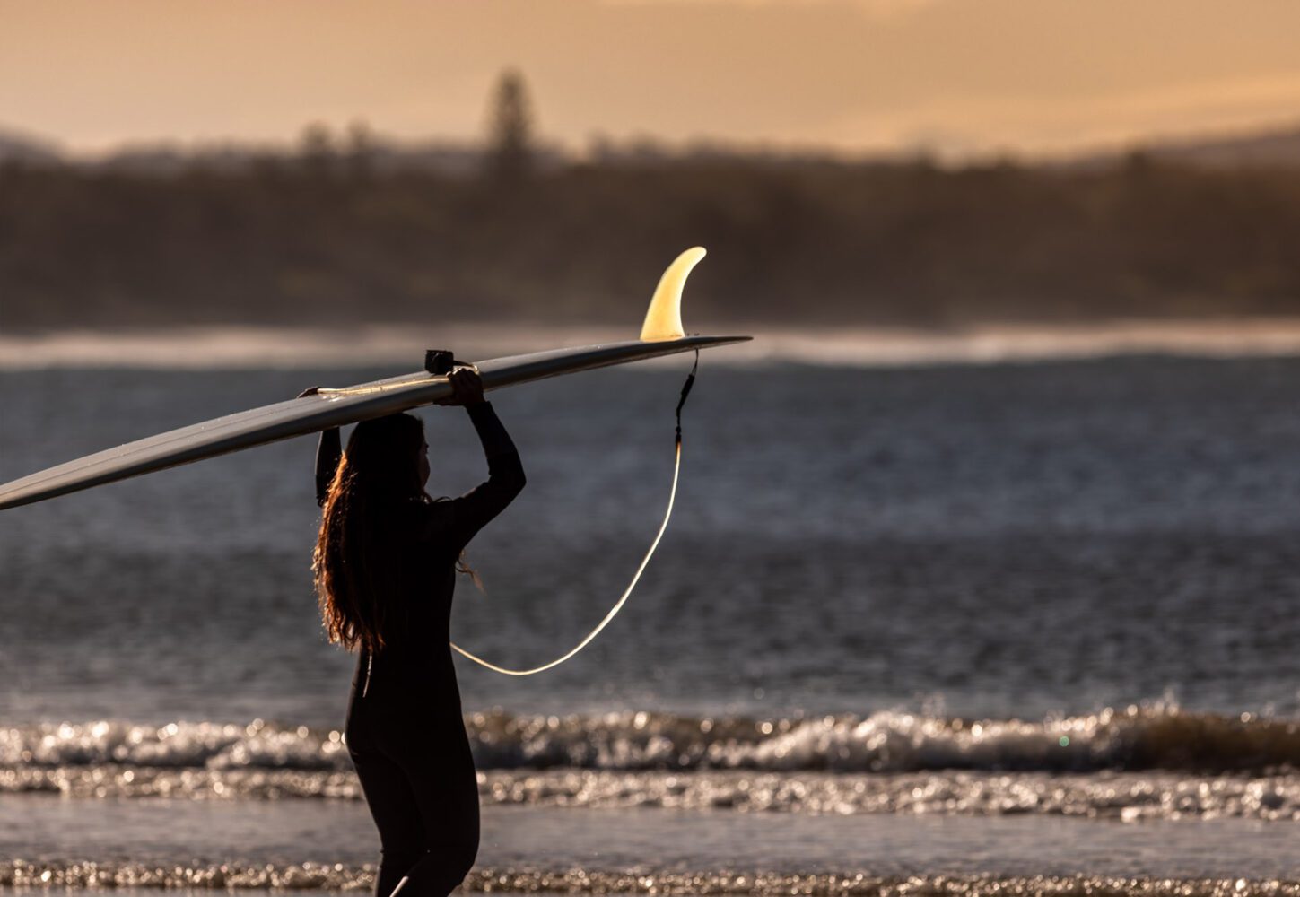 Woolgoolga Main Beach Surfer